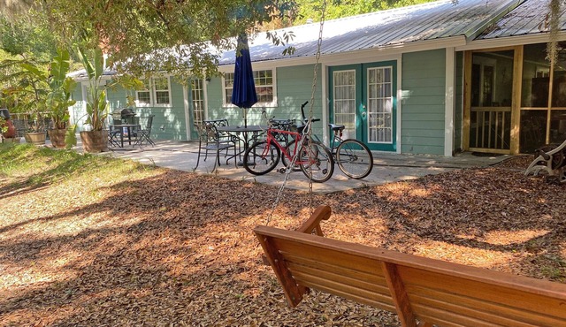 A comfortable home in a quiet neighborhood graced with Spanish Moss draped oaks.