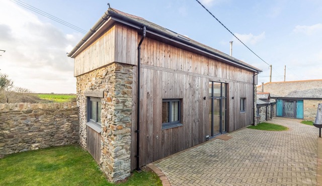 A converted barn that has been restored into a bright, modern holiday home.