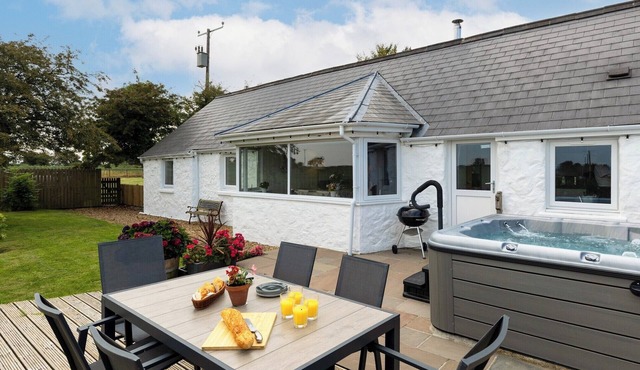 A cosy countryside cottage with a hot tub under the stars.