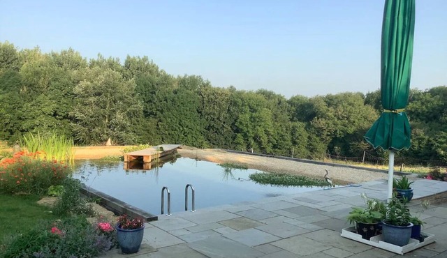 A Cottage and The Railway Carriage with use of a Natural Pool.