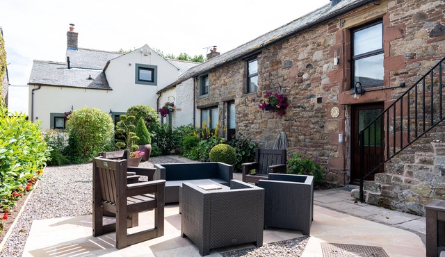 A cottage that sleeps 8 guests in 4 bedrooms