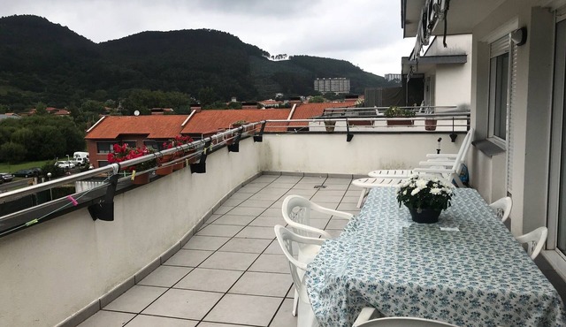 a cozy and charming pennhouse with a wonderful view
