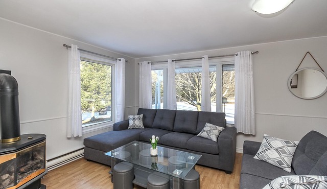 A cozy family retreat surrounded by trees, Nature, comfort and family memories.