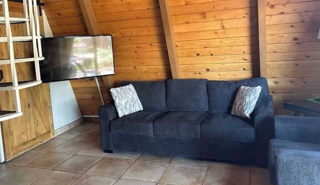 A cozy forest-side chalet with beautiful views of Sedona's red rocks.