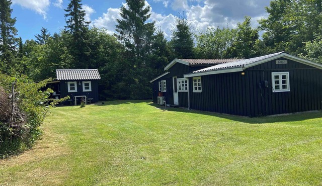 A cozy older summerhouse on a small island