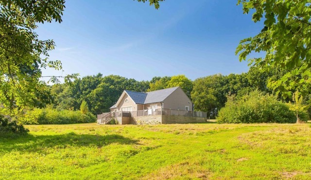 A delightful lodge with hot tub on Wakes Hall Farm is a haven of peace in 500 acres of private land