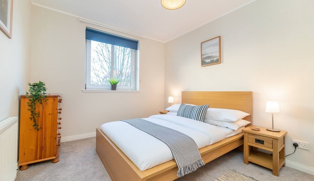 A delightful two-bedroom apartment with private parking space. Sleeps 6.