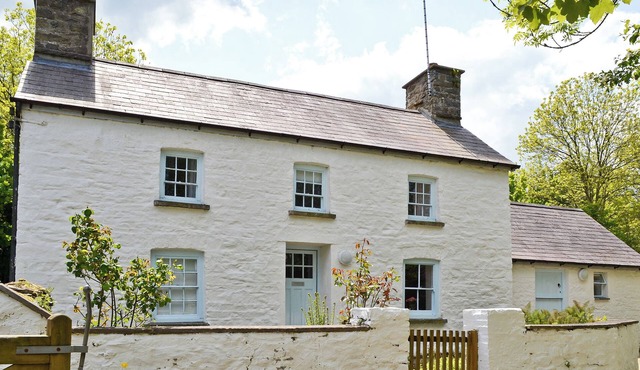 A detached character cottage with beams, wood burner and enclosed garden.