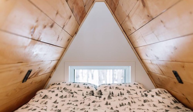 A Frame Cabin at the top of a ski hill