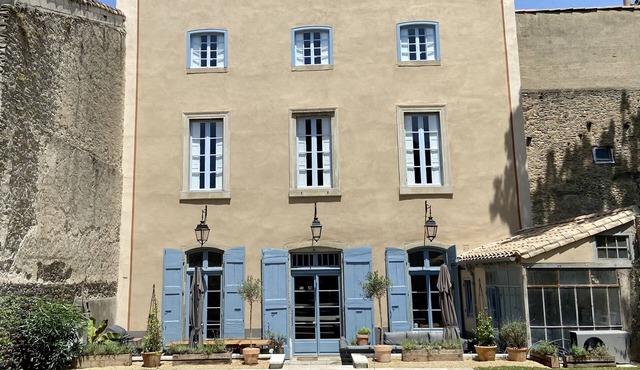 A "French Country House in Town" with private garden, pool and cinema room