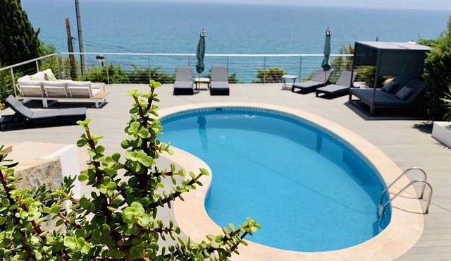 A fully renovated, luxury four bedroom villa with breathtaking sea views