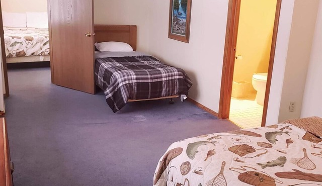 A fun fishing themed private guestroom for up to 5 inside the Lodge at North Ironwood Acres resort. TWO bathrooms! DOG FRIENDLY!.