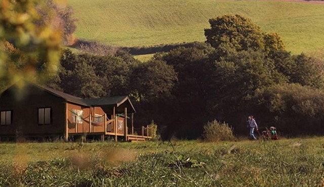 A home from home canvas-wrapped three bedroom colonial style tent.