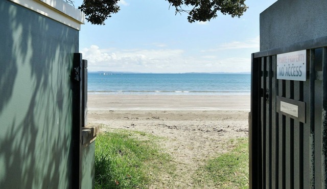 A Kiwi beachside holiday a couple of minutes walk to the sand .