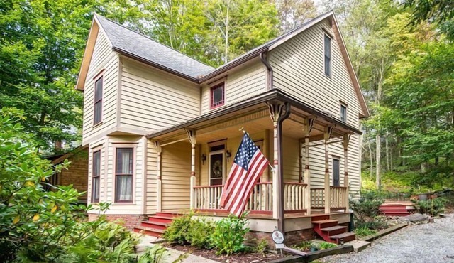 A large inviting deck beckons you to "Victoria" in Eagles Mere