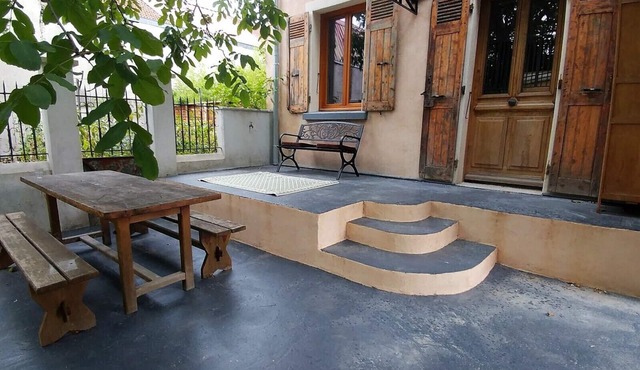 A LITTLE CITY GARDEN AND ITS PRIVATE PARKING AREA