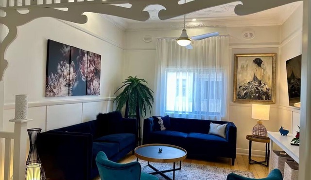 A lovingly restored cottage with beautiful Lake Macquarie less than 100m away.