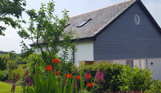 A luxurious spacious home, village location. 5 mins to the beach, EV Charger.