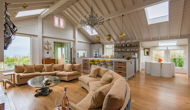 A luxurious waters-edge holiday home by the sea sleeping 11 right on the beach