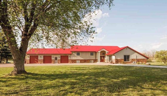 A MANSION WITH A HUGE INDOOR HEATED SWIMMING POOL WITH A BONUS THEATER ROOM.