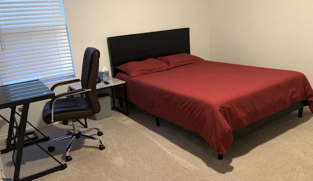 A master bedroom suite with its own bathroom and kitchen