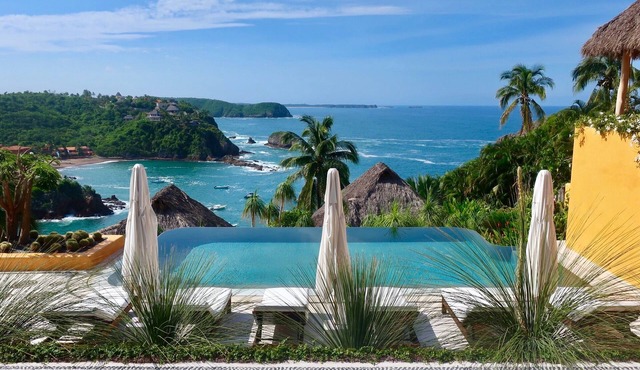 A Mexican oasis of artistry + style with private stairs to beach and boat.