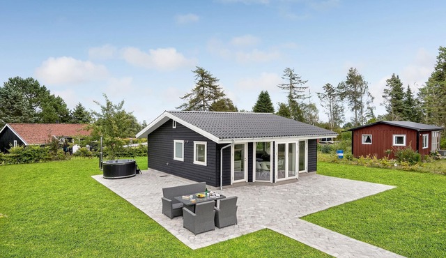 A modern and bright vacation home welcomes you to Bogø.