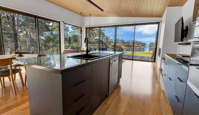 A modern and exquisitely decorated studio perched atop the serene shoreline