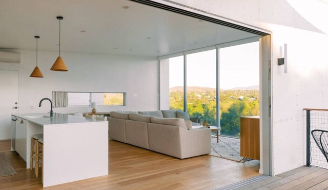 A modern light-filled home with views of the woods