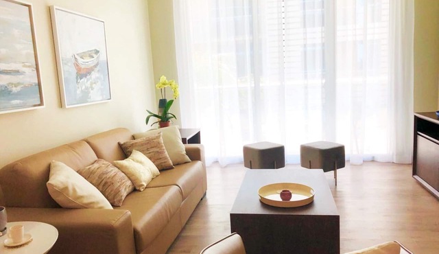 A modern style, freshly, large beachfront apartment in the middle of the action