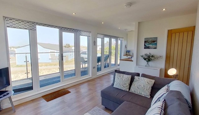 A newly renovated chalet with a fabulous enclosed deck and close to the beach.