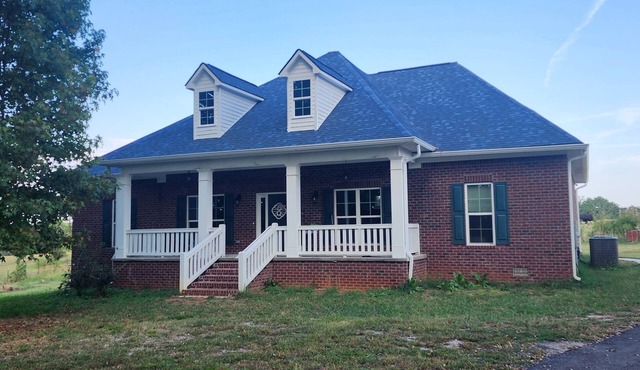 A picturesque getaway in a peaceful countryside lake setting.