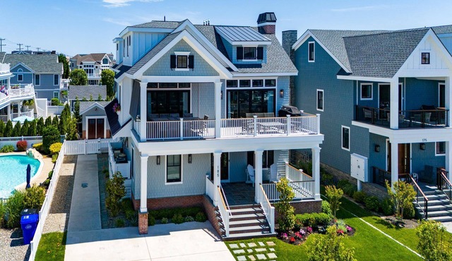 A premier beach block retreat designed for the ultimate coastal getaway with a POOL, ELEVATOR and OCEAN VIEWS.