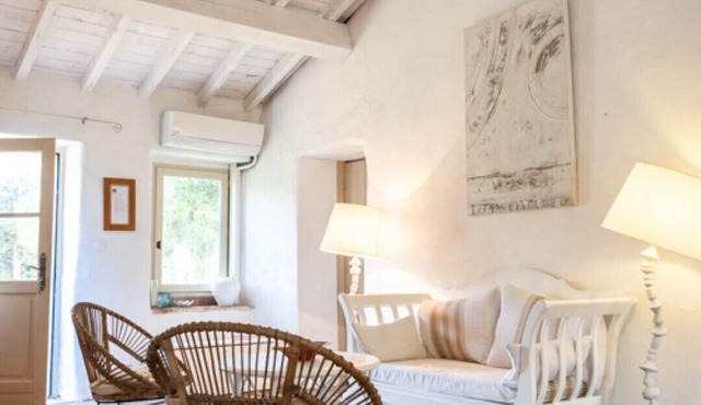 A pretty cottage in the middle of a park in the south-west countryside