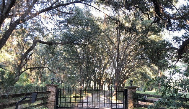 A Private Country Home on 15 Beautiful Acres just miles away from city life!