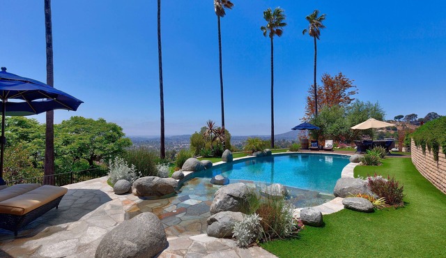 A private oasis to relax and play in the comfort of a gated 2-acre estate.