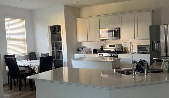 A Room in a charming brand new house with kitchen, AC, and WiFi in McKinney