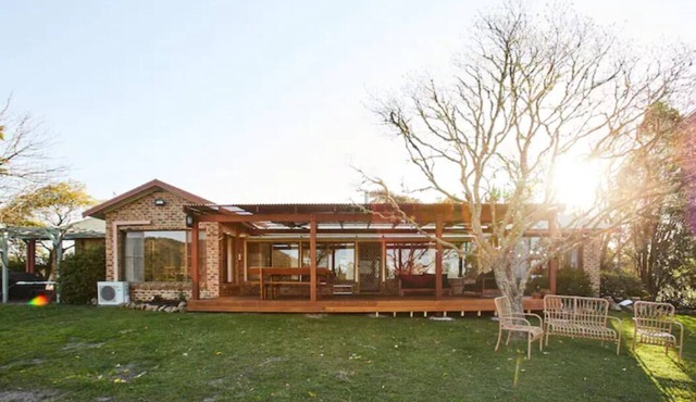 A rural retreat on 15 acres with swimming pool and direct river access.