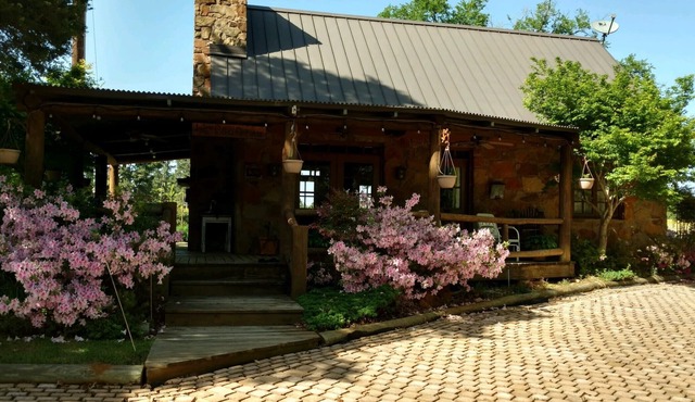 A rustic stone cottage on an estate close to the Texas State Railroad.