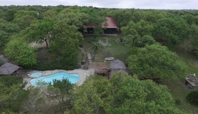 A secluded cabin and art oasis nestled on 35 acres in the Texas Hill Country .