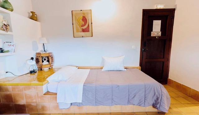 A small room with kitchen and bathroom