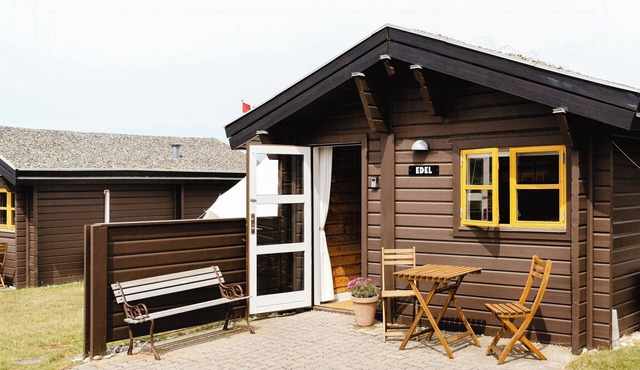 A small wooden hut in a large community