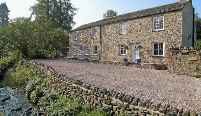 A spacious detached cottage located by a beck in a quiet village.