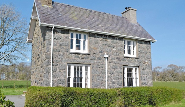 A spacious detached property with an open fire and enclosed garden.