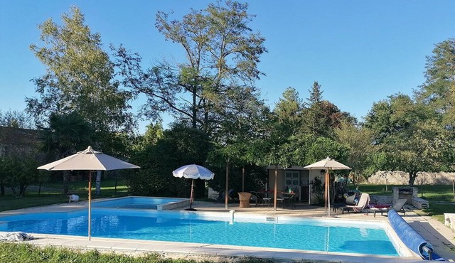 A stone lodge set in the grounds of an old farmhouse in the Charente countryside