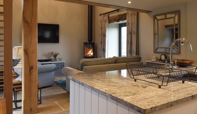 A stunning barn conversion with hot tub, great views and a very comfy kingsize bed.