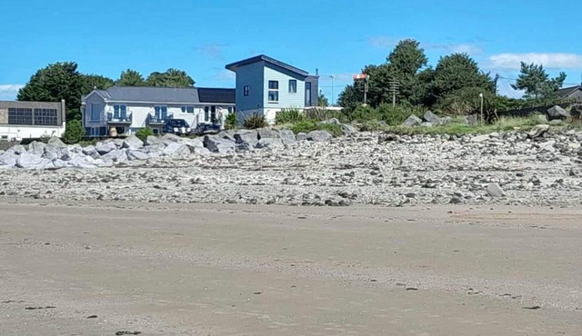 A Stunning Beachfront Retreat with Breathtaking Sea Views and Beach Access