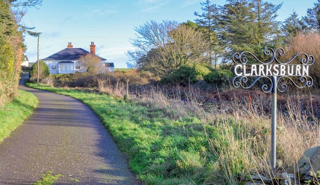 A superb 4 bedroomed cottage with glorious gardens and stunning sea views.