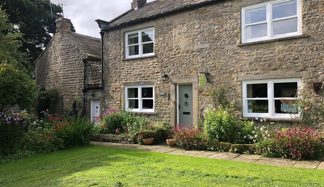 A Traditional Dales Cottage with log burning stove in the village of Romaldkirk.