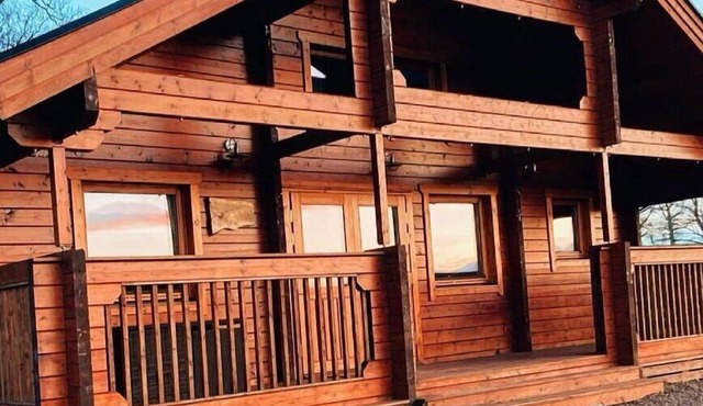 A traditional Scandinavian style lodge, with stylish wooden interior decorated with a Scottish theme